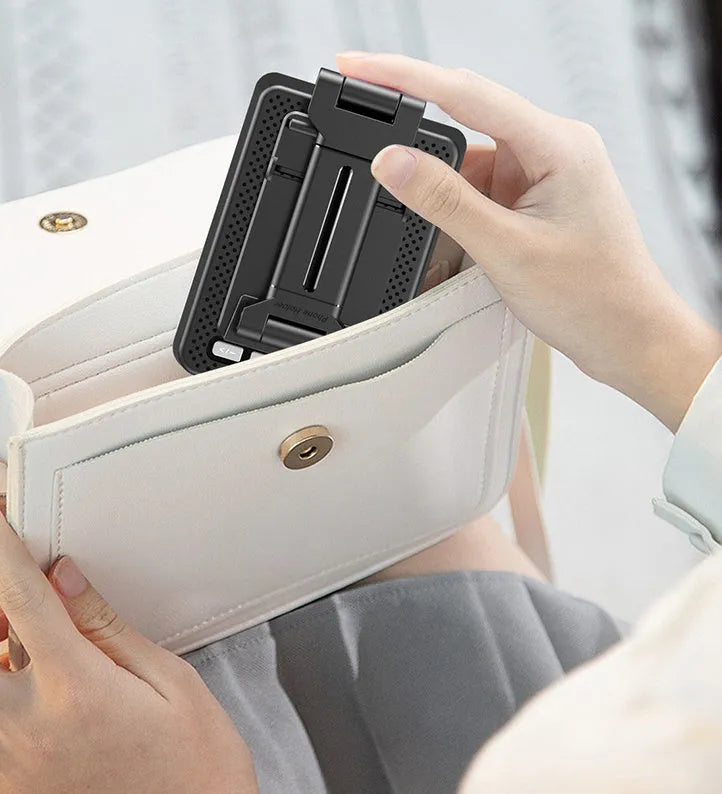 Black mobile phone stand with Bluetooth speaker on desk showing 135cm height and USB charging port