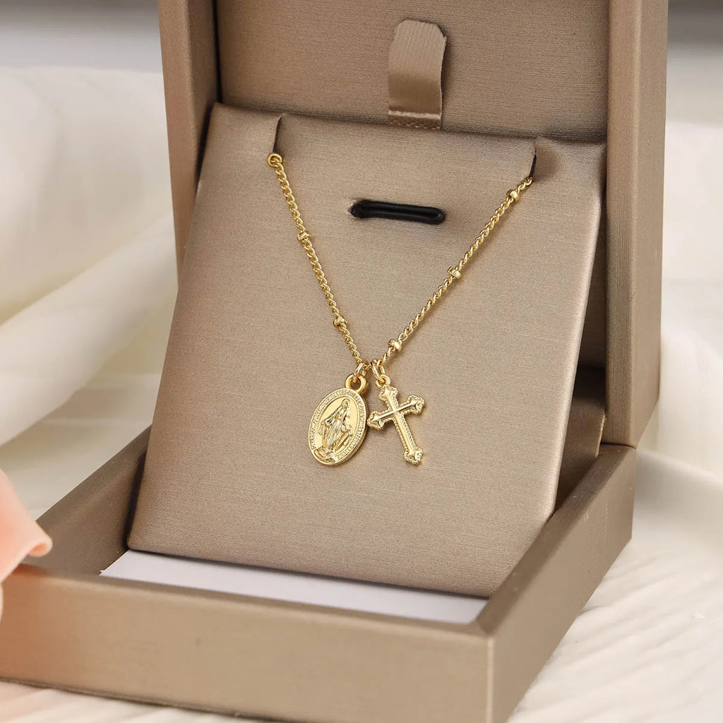 Gold geometric cross necklace on a 45cm chain with adjustable clasp
