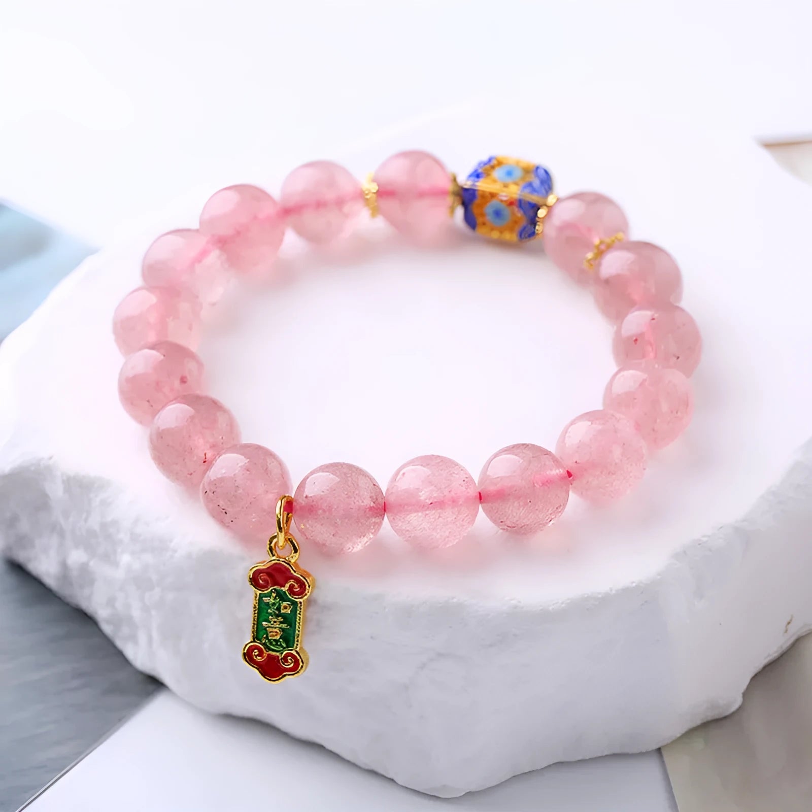 Pink strawberry quartz crystal bracelet with Chinese Ruyi symbols and hand-woven beaded design for women
