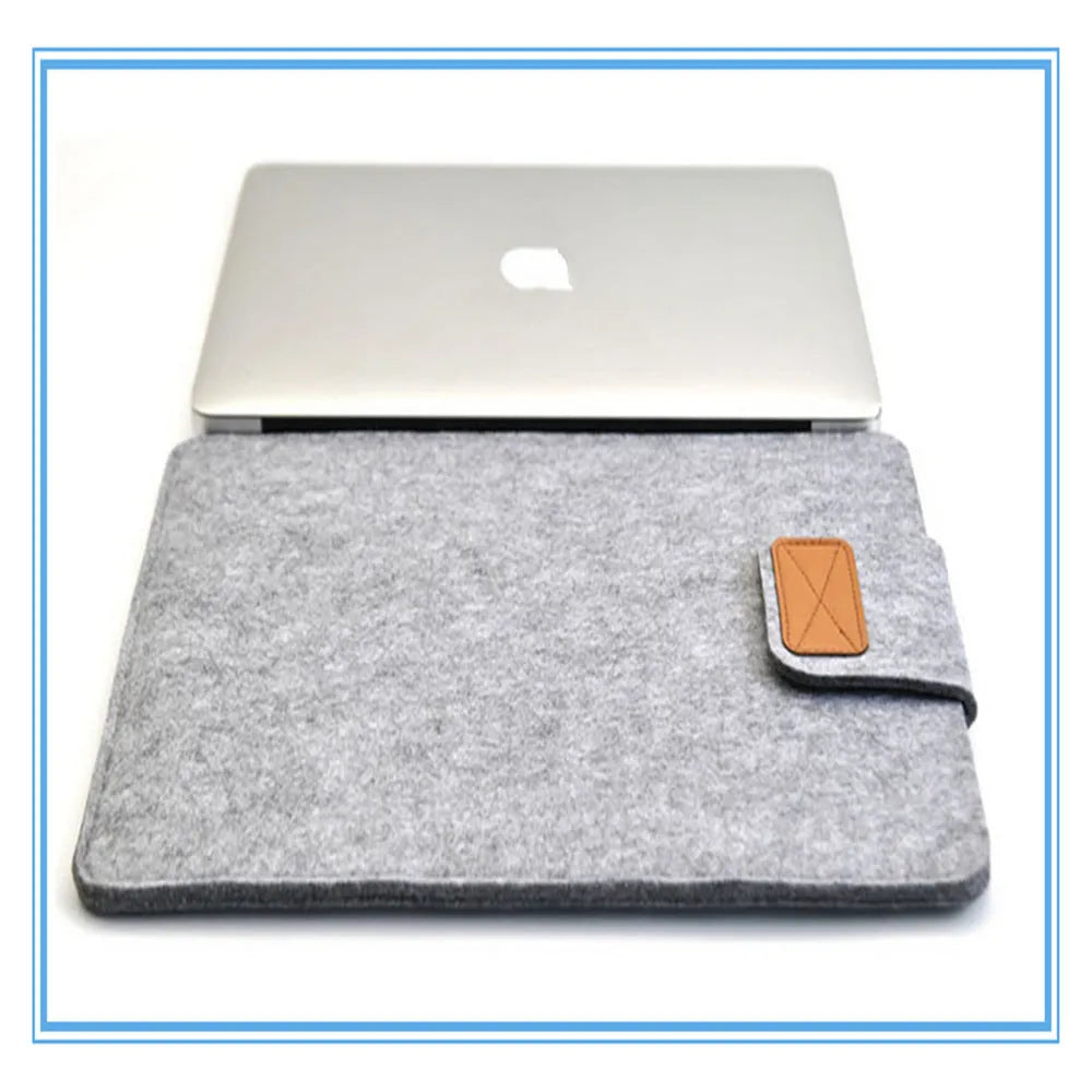 Dark grey clamshell laptop bag showing interior with polyester lining and corner protectors