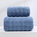 Coral fleece striped bath towel set showing hand towel and bath towel in grey and pink.