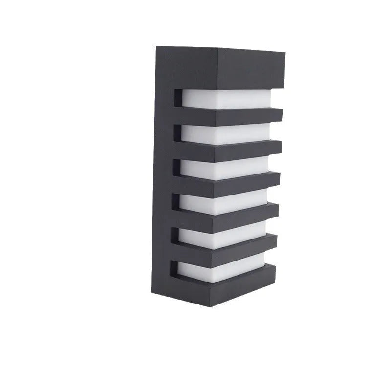 Modern minimalist layered aluminium outdoor wall lamp mounted on a wall.