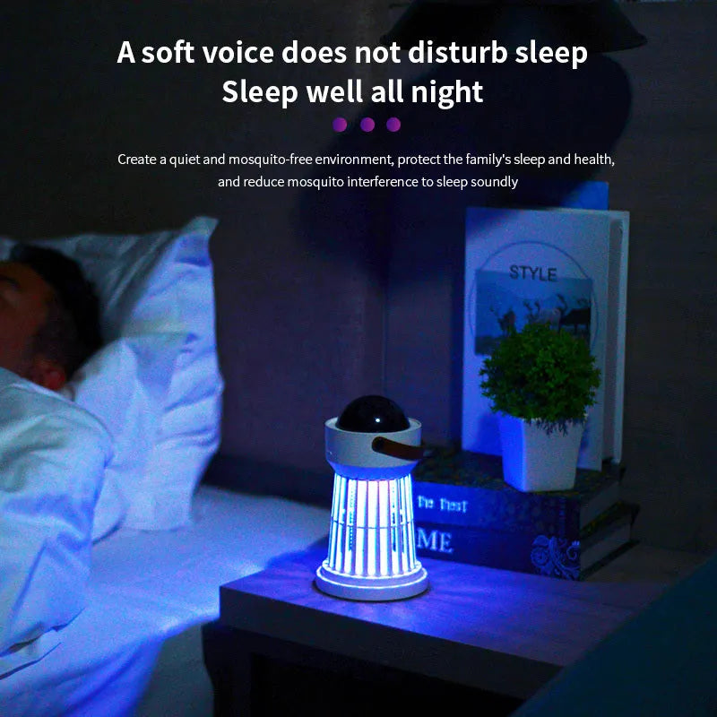 White electric mosquito killer lamp with star projection feature and a folding handle on a table.