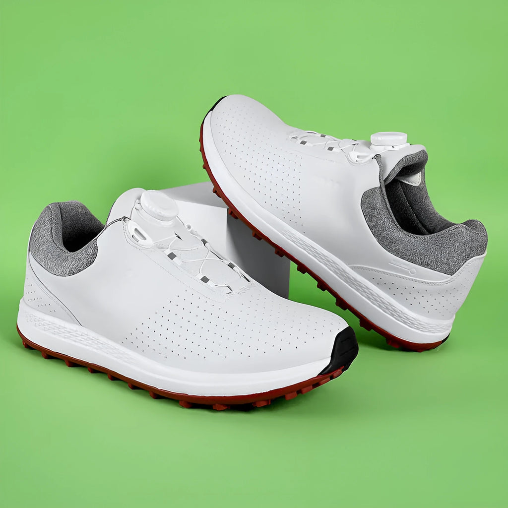 Men's white low-top casual golf shoe with breathable holes and non-slip rubber sole.