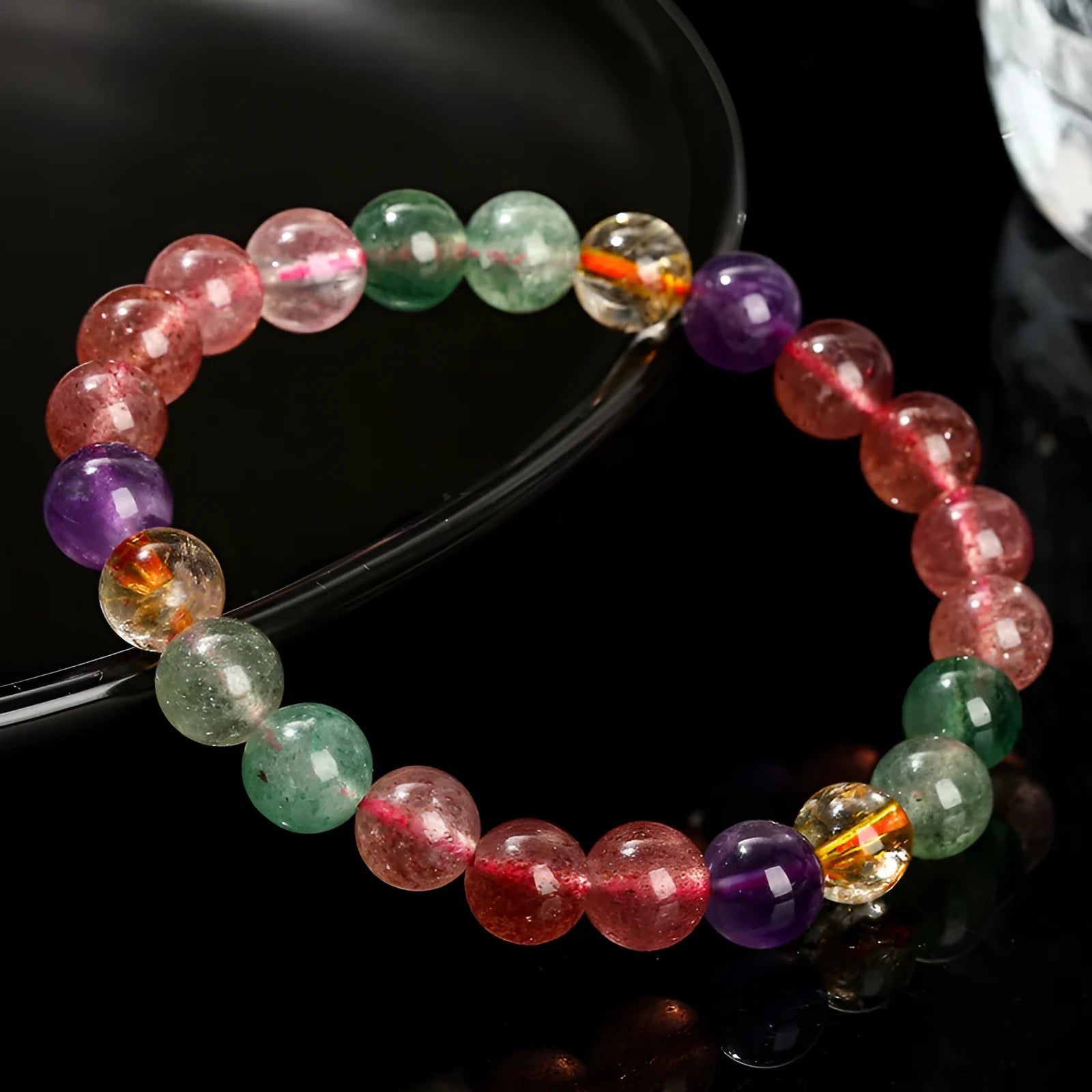 Women's strawberry quartz bracelet with round beads in a natural tourmaline colour