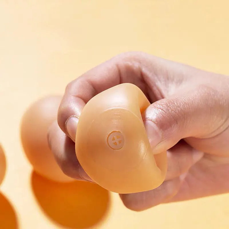 Simulation egg-shaped dog chew toy with squeaker sound for dental play