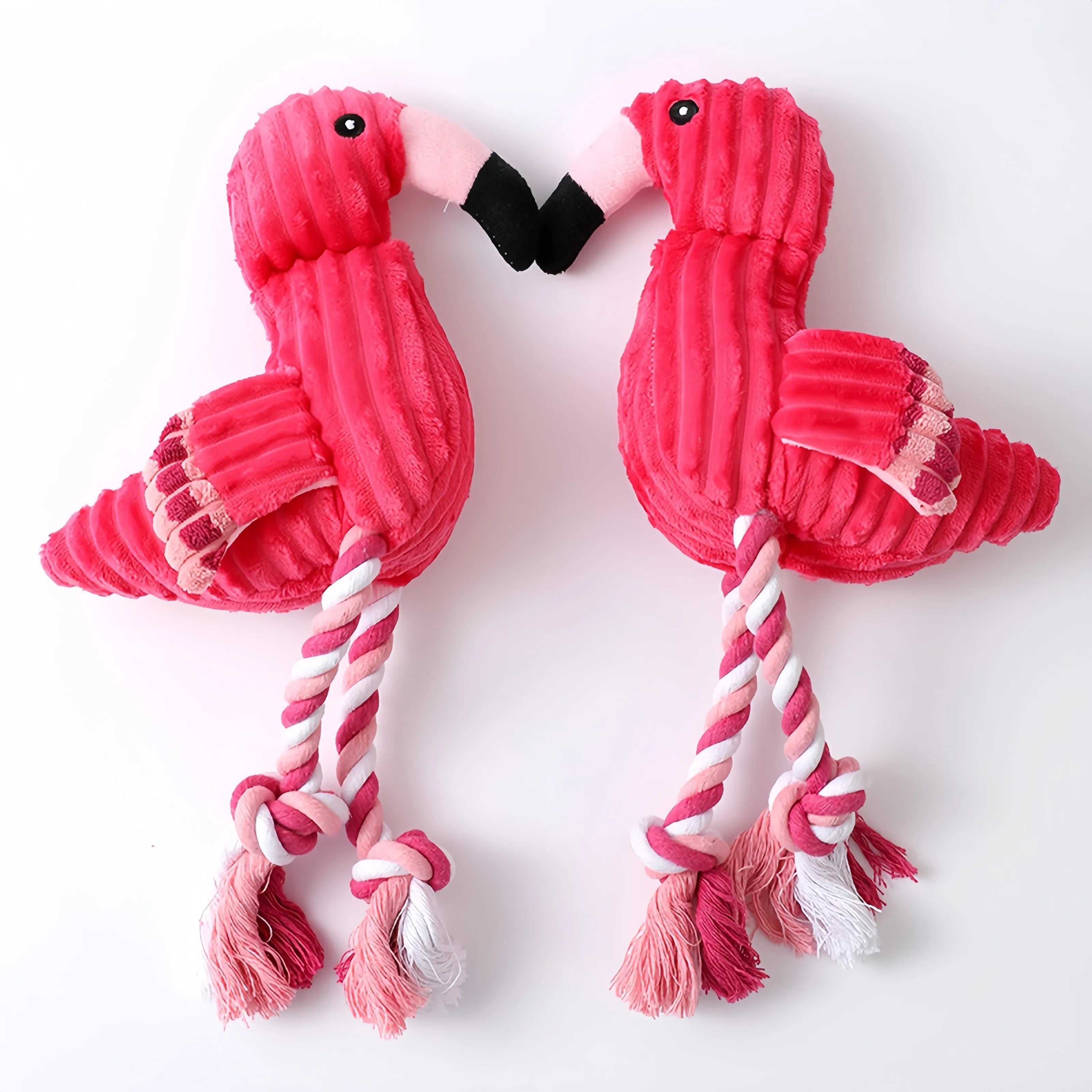 Pink animal-shaped corduroy dog toy with squeaker for bite-resistant play