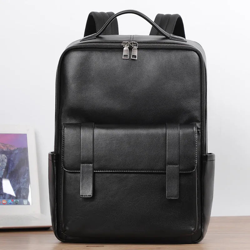 Men's black genuine leather large capacity computer backpack with woven details.