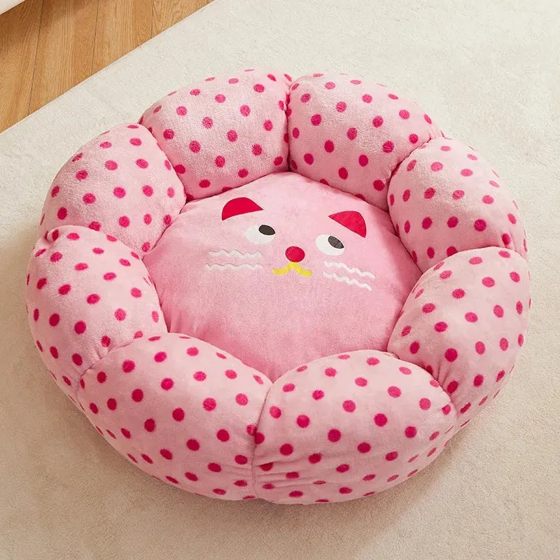 Pink dot pattern fabric cat bed shown in two circular sizes, 45cm and 65cm diameter.