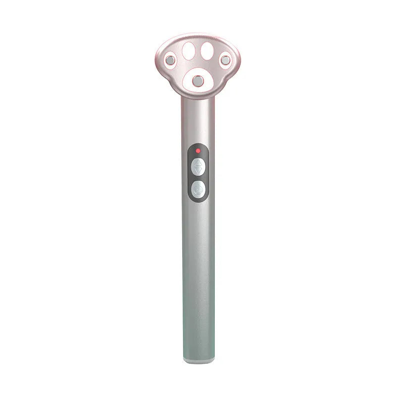 Gradient pink Cat's Paw shape micro-current eye massager with colour light therapy on a white background.