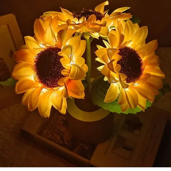 Rechargeable artificial sunflower LED night light on a table