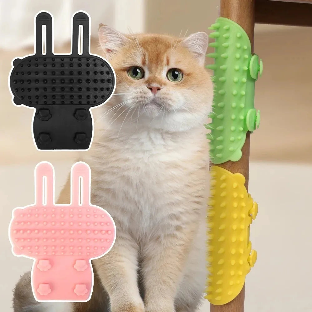 Black silicone cat grooming comb with adjustable strap attached to a table leg, showing rounded teeth for hair removal