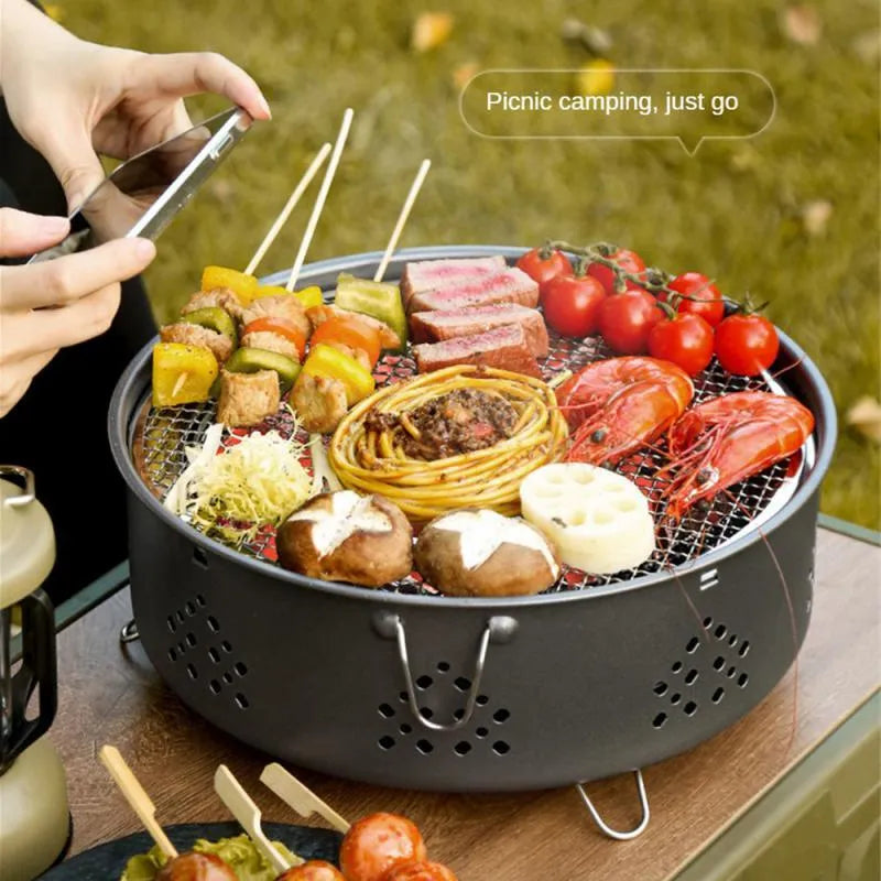 Portable stainless steel BBQ grill with detachable parts and storage bag for outdoor cooking