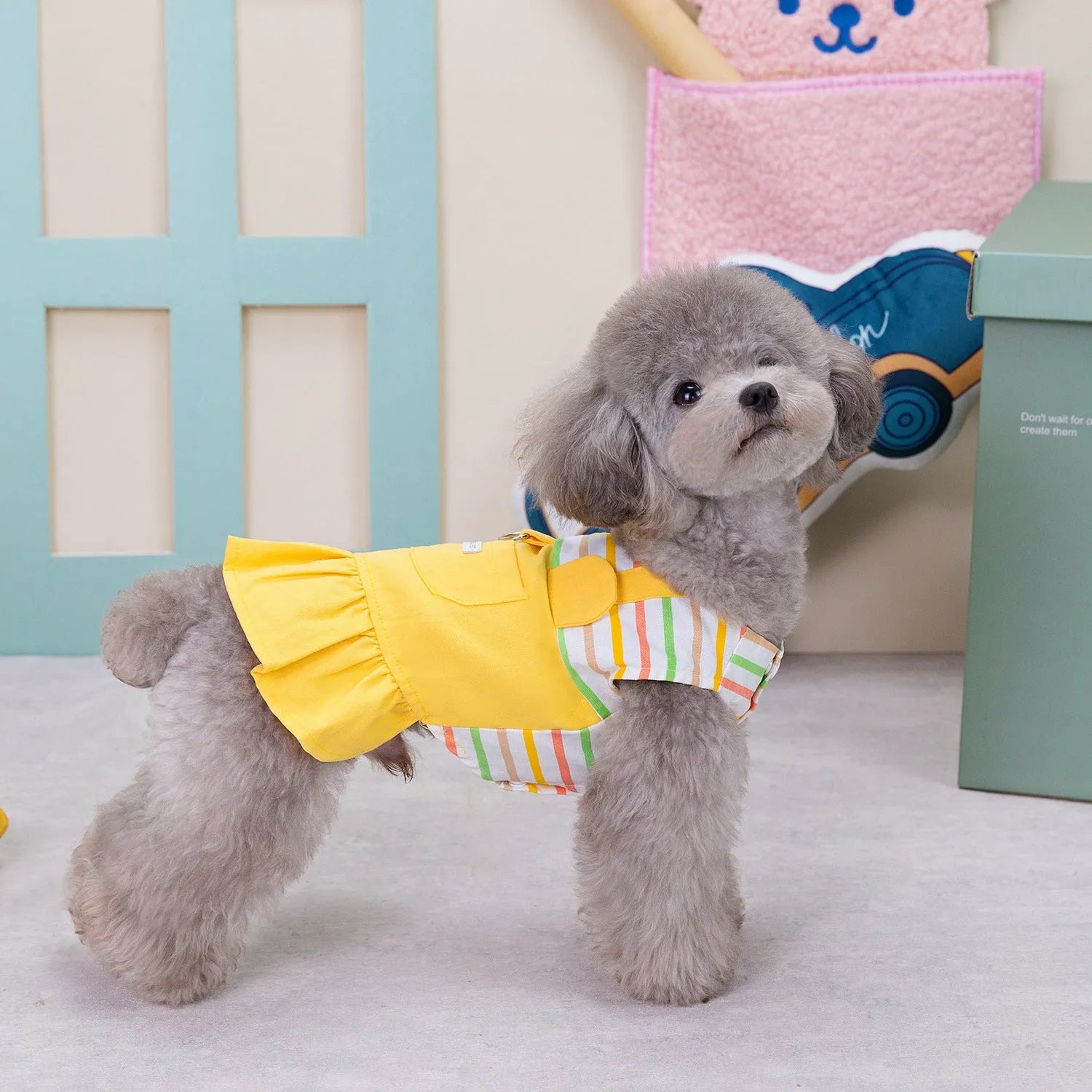 Orange and yellow striped patchwork cotton skirt for dogs on mannequin
