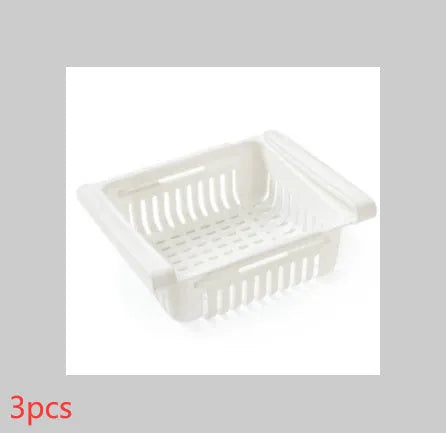 Blue telescopic refrigerator storage basket with adjustable width from 22cm to 34cm on a kitchen counter