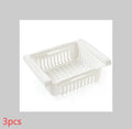 Blue telescopic refrigerator storage basket with adjustable width from 22cm to 34cm on a kitchen counter