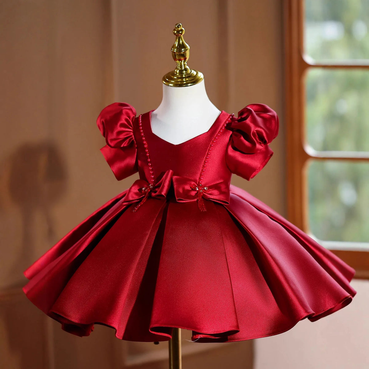 Girls wine red polyester princess party dress for birthdays and evening events, available in 80cm to 150cm height sizes.