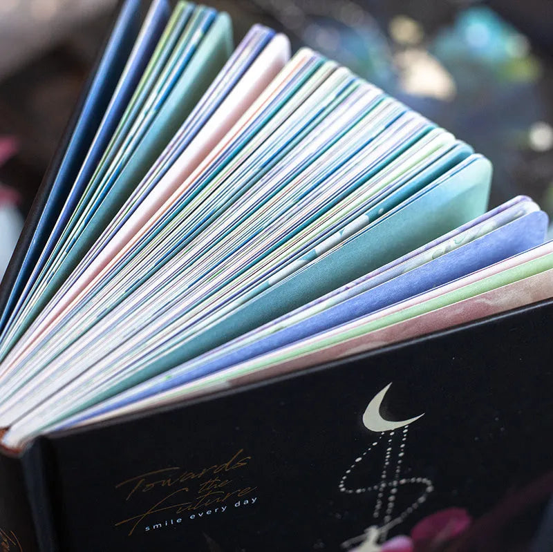A5 notebook with luminous cover in Deep Blue, open to show colour illustration pages, size 21 x 14.8 cm
