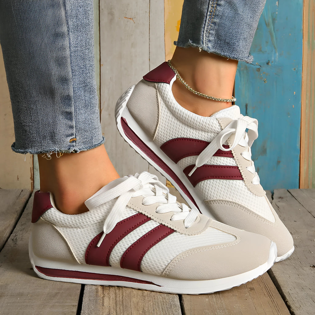 Wine red Cortez Retro low-top sneakers with cross-strap detail on synthetic leather upper.