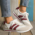 Wine red Cortez Retro low-top sneakers with cross-strap detail on synthetic leather upper.