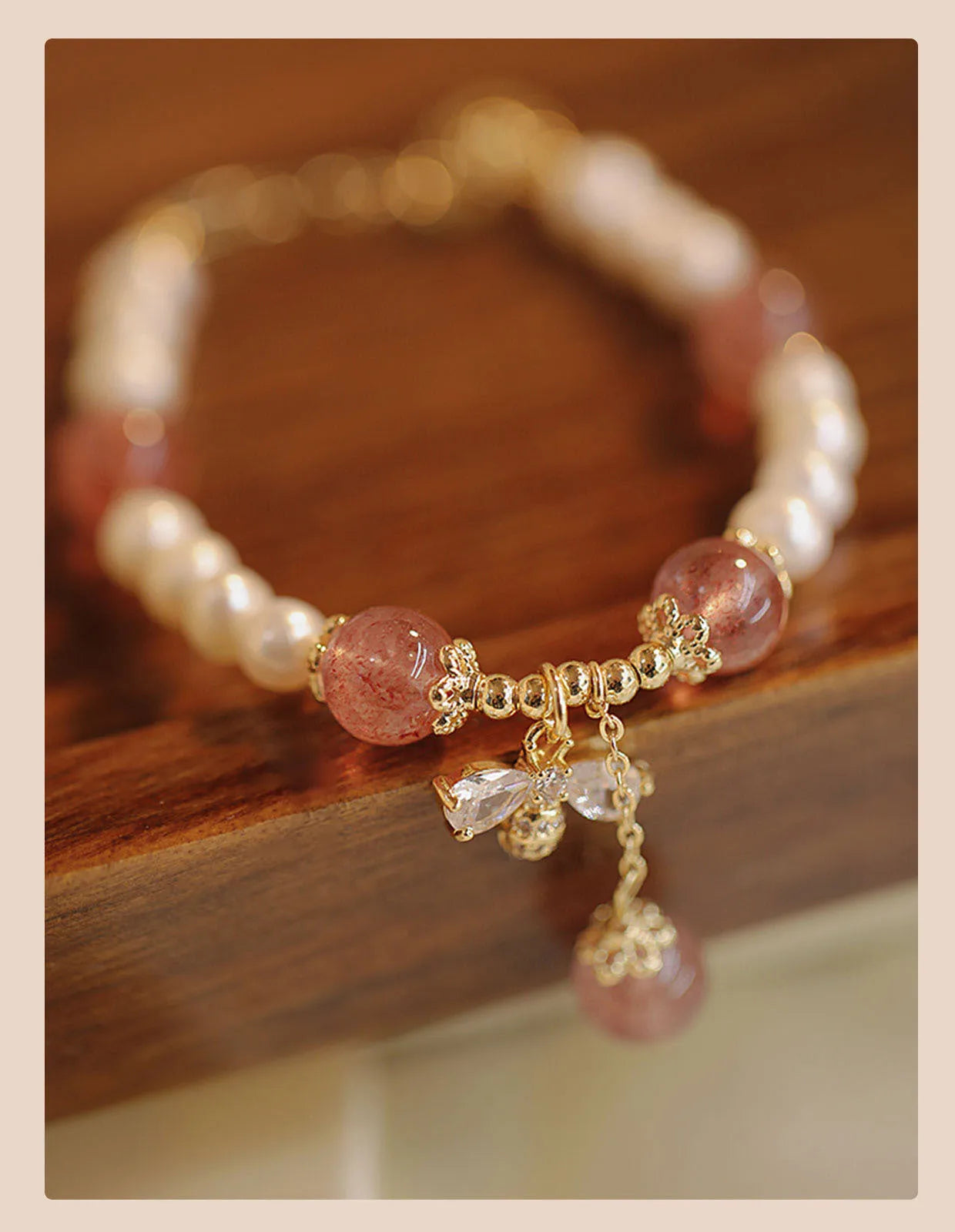 INS style women's bracelet with strawberry quartz stringed pearls and a central bow detail