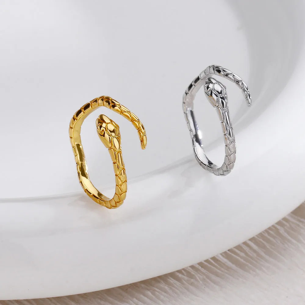 Open snake ring with textured copper band, electroplated in platinum or gold colour