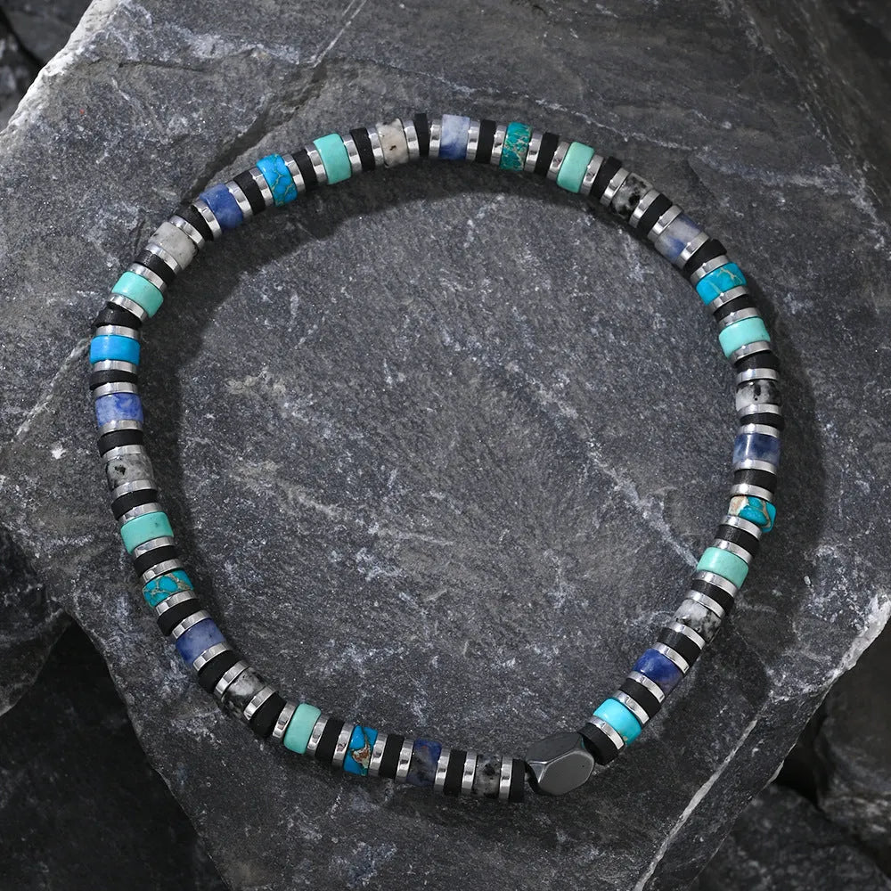 Hand-woven Bohemian bracelet with natural semi-precious stones in cylindrical geometric shape