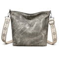 Soft PU large capacity crossbody bag in pink, grey, or yellow with an adjustable shoulder strap.