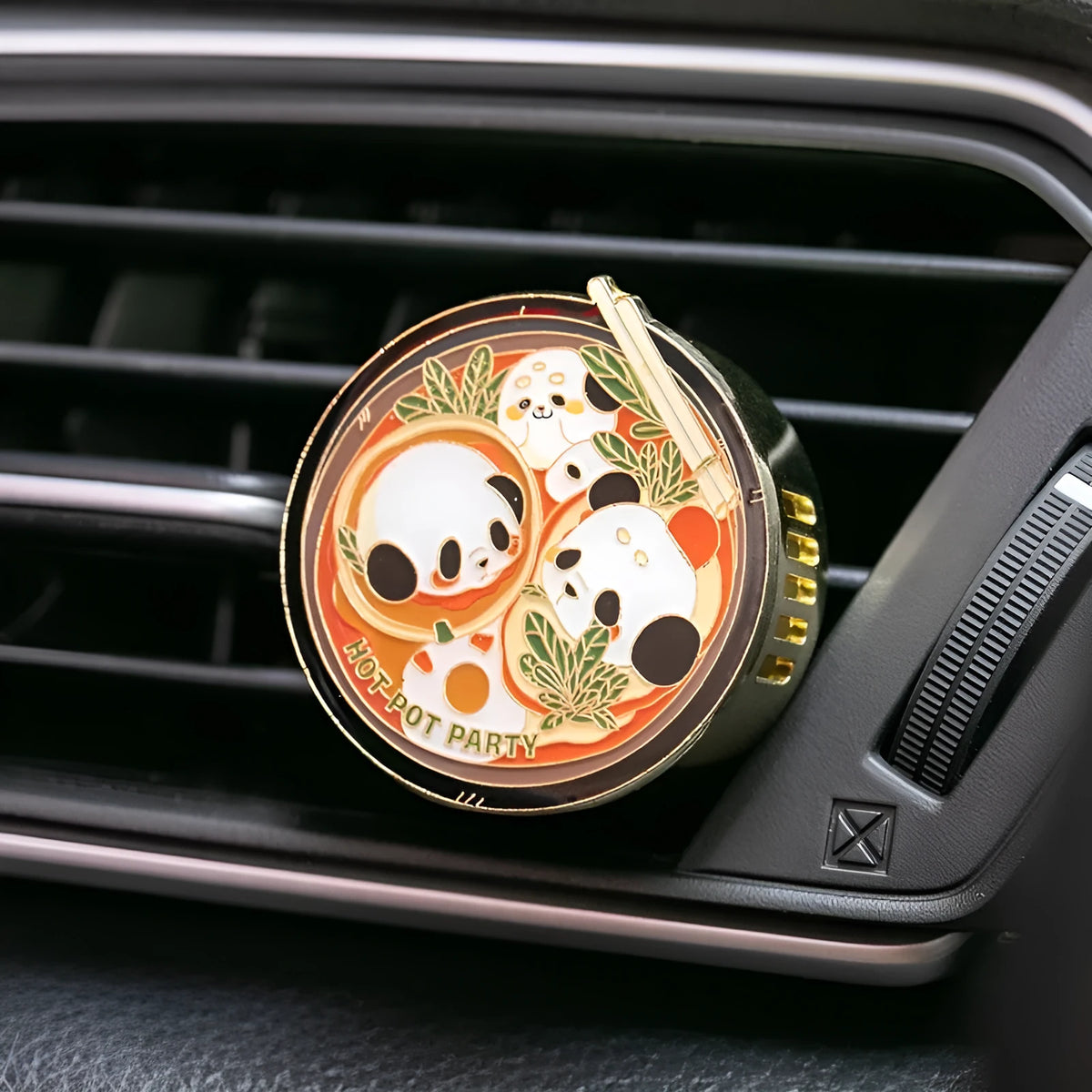 Panda hot pot shaped car air freshener diffuser mounted on a car vent with diatomaceous earth fragrance tablets