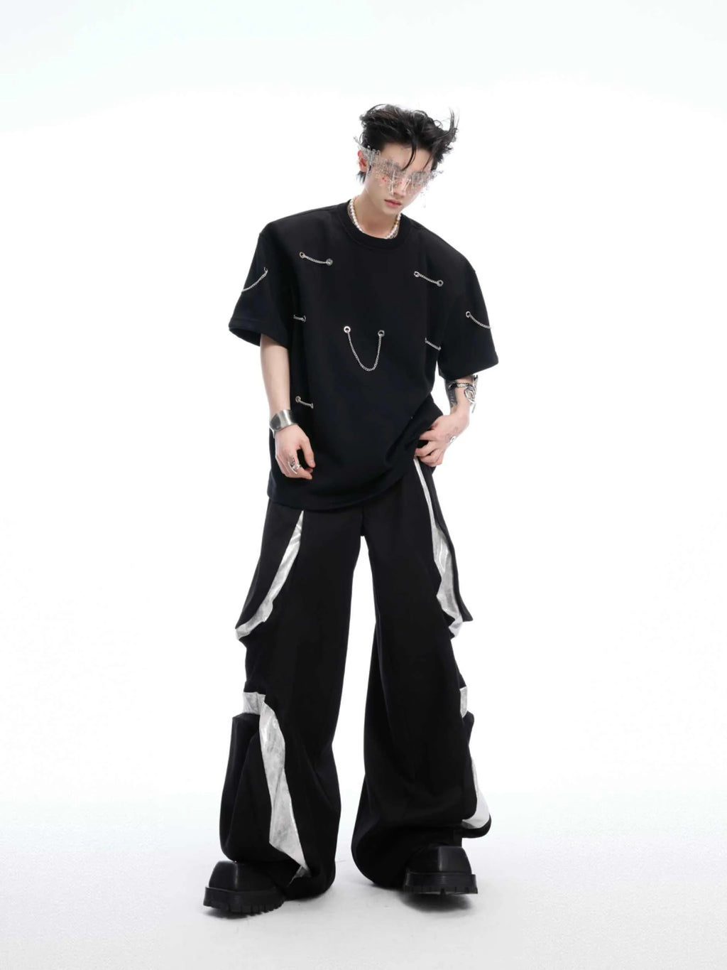 Black men's T-shirt with metal chain detail on padded shoulders, short sleeves, and round neck.