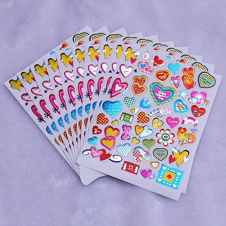 100-piece pack of gold-detailed cartoon heart waterproof reward stickers laid out.