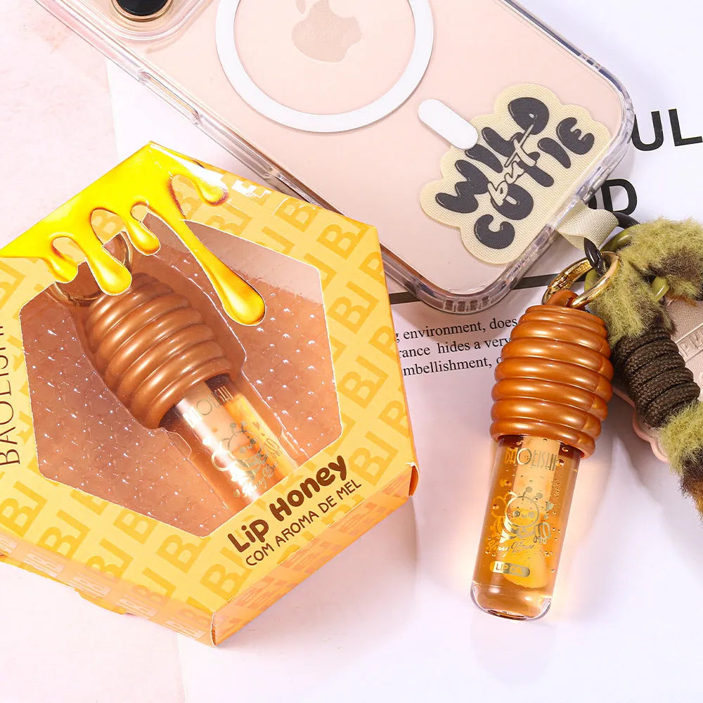 Portable honey lip gloss attached to keychain with moisturising properties