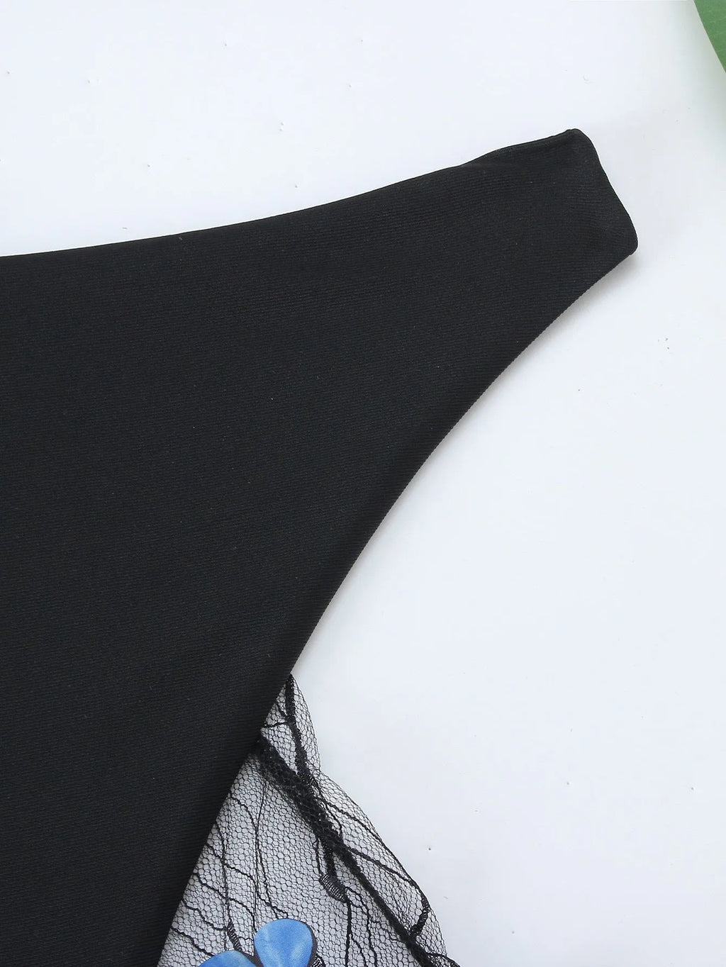Black women's bikini set with butterfly embroidery showing top, underwear and pants pieces