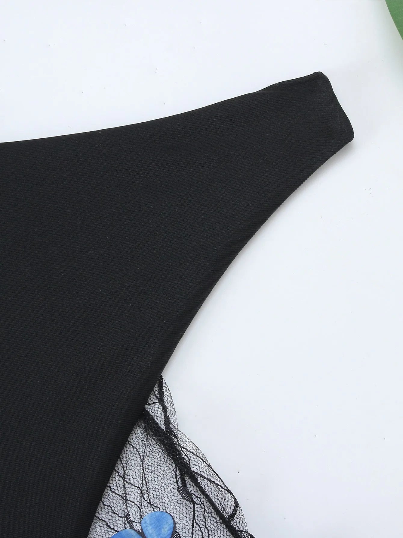 Black women's bikini set with butterfly embroidery showing top, underwear and pants pieces