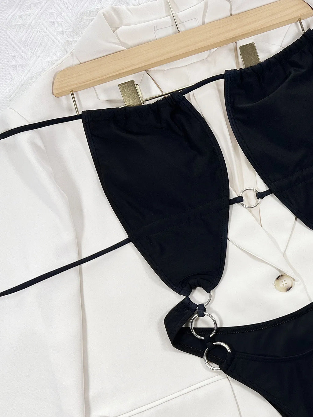Black sleeveless one-piece women's swimming suit made from nylon fabric for swimming activities