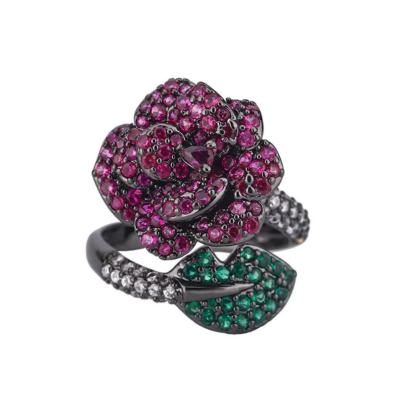 Geometric flower ring with black gold plating and red corundum stone