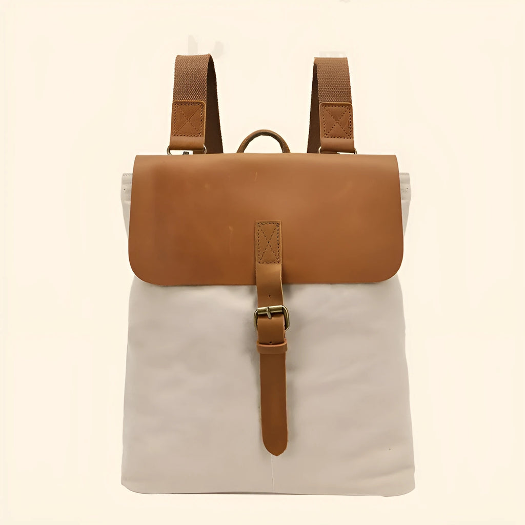 Minimalist Crazy Horse leather and canvas student backpack in neutral colours showing compact dimensions