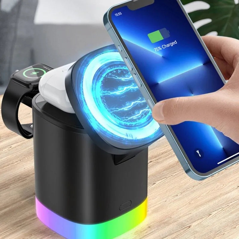 Black 3 in 1 magnetic wireless charging cube showing iPhone, Apple Watch and AirPods charging simultaneously with RGB lights