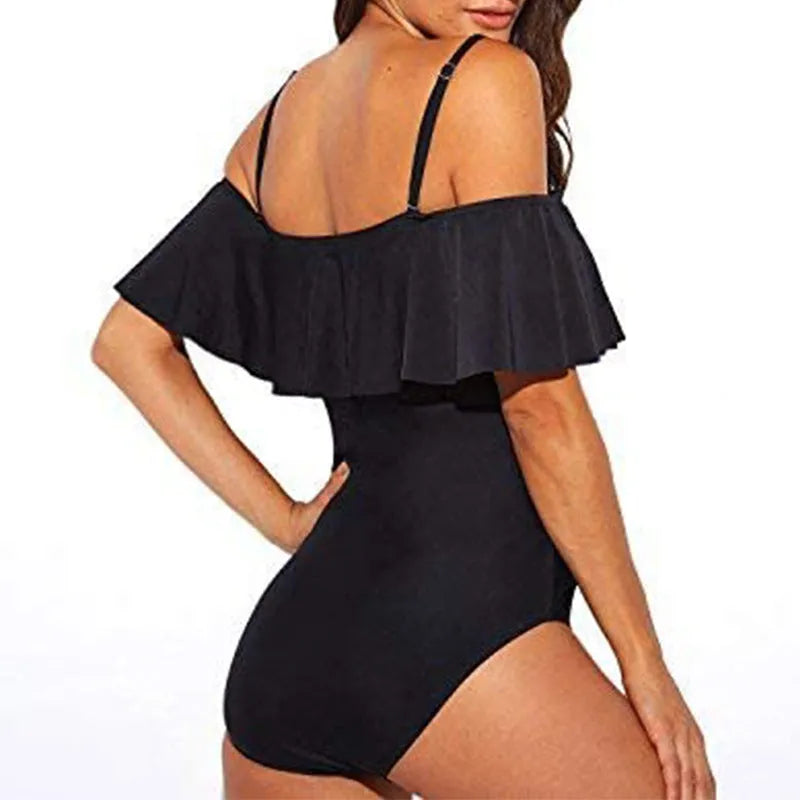 Black one-piece swimsuit with cut-out design and ruffled straps for swimming activities