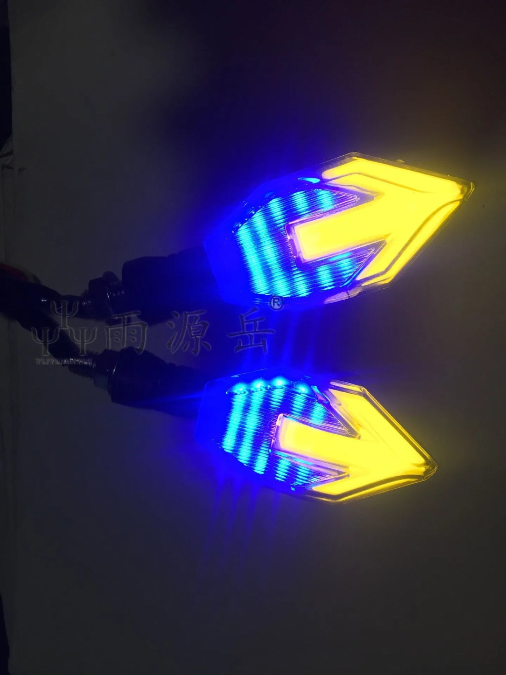 Arrow-shaped LED motorcycle turn signal lamp for 12V systems, made from black ABS plastic.