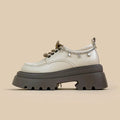 White women's platform Mary Jane shoes with round toe, thick chunky heel, and front lace-up closure on a neutral background.