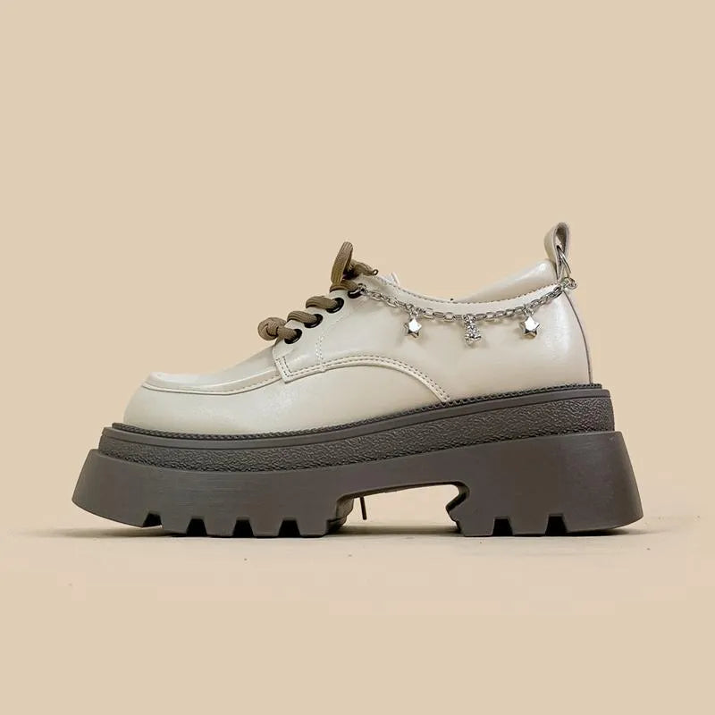 White women's platform Mary Jane shoes with round toe, thick chunky heel, and front lace-up closure on a neutral background.