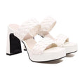 Round toe open toe high heel sandals with woven foot, chunky platform, white or black PU upper and rubber sole.