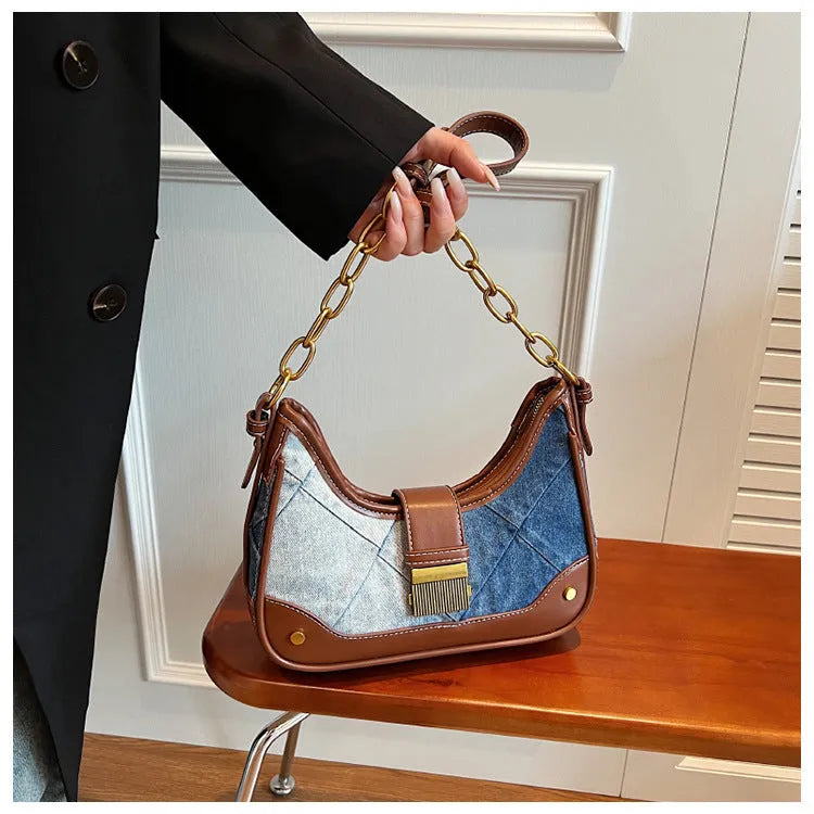 Brown denim women's bucket shoulder bag with diamond mesh detail, chain accents, and double adjustable straps