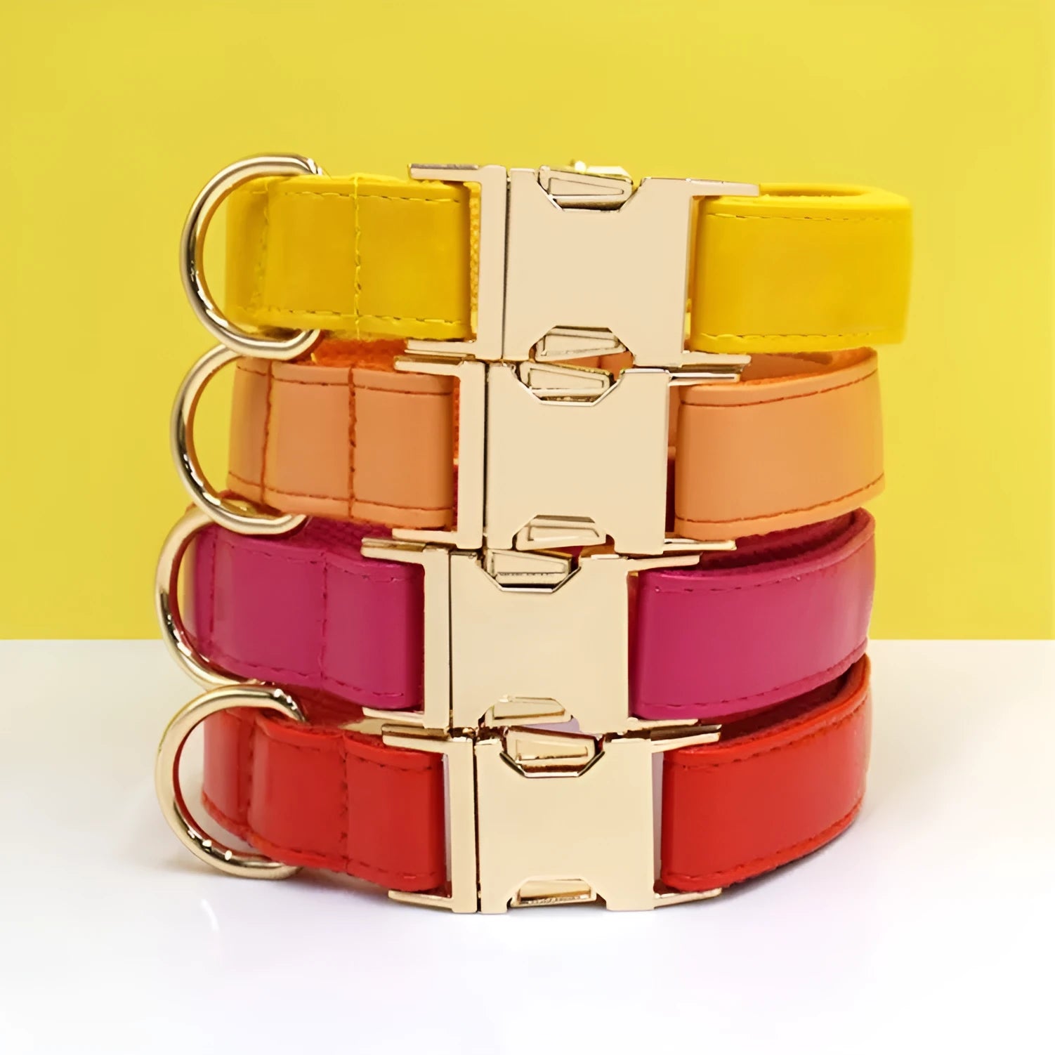 Leather dog collar with velvet texture section in colour block design, shown on a buckle.