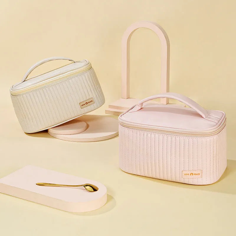 Open-top pink PU leather makeup bag showing interior space for cosmetics organisation