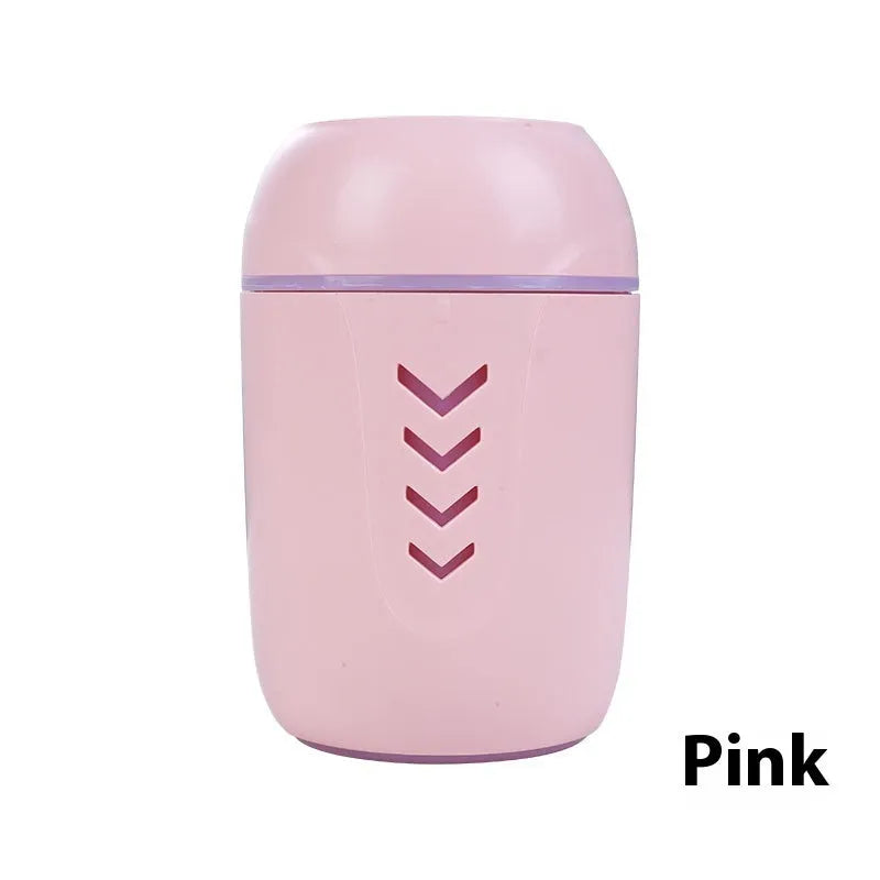 Round portable air purifier in blue, pink, or white with USB cable for vehicle or desktop use