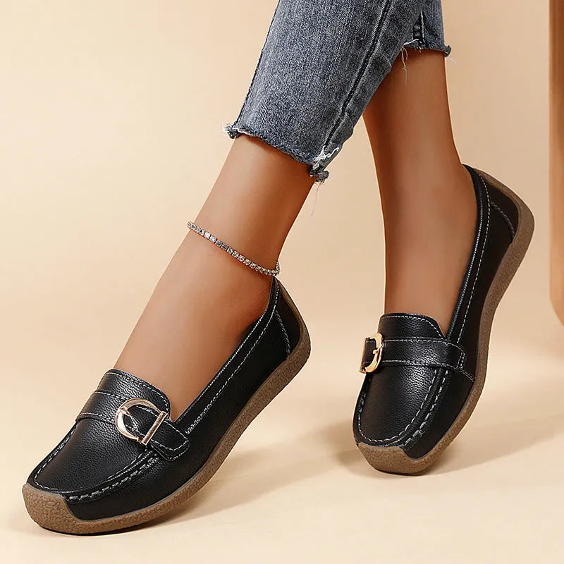 Women's beige casual loafers with round toe, flat heel, and shallow slip-on design.