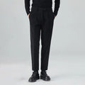 Men's beige straight-leg corduroy trousers with a mid waist and micro elasticity, laid flat.