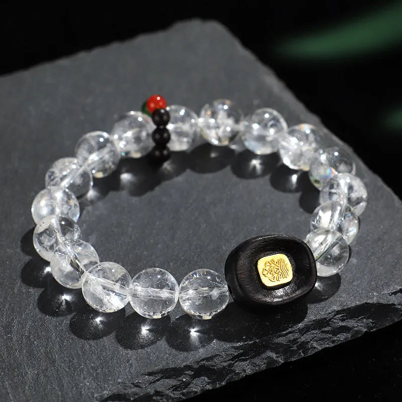 Natural white crystal ebony five warp bracelet on wrist showing wooden beads and ethnic design